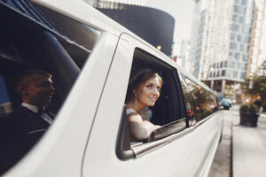 Elegant bride sitting in a white car. Couple in a big hummer limousine san diego, ca