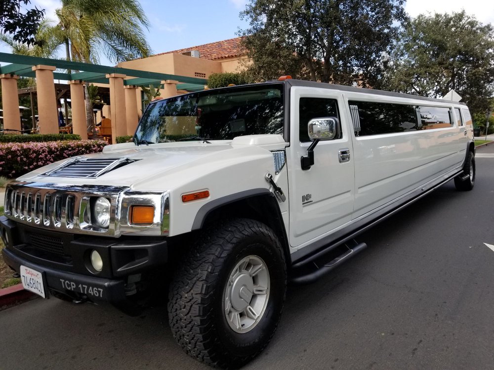 Hummer Limo Rental Near Me with White Stretch for 20 passengers.