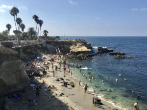 people-on-la-jolla-cove-beach-with-city-captain-transportation-from-San-Diego-Airport-scaled